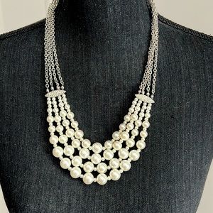 Chicos costume, four strand pearl necklace with rhinestone embellishments
